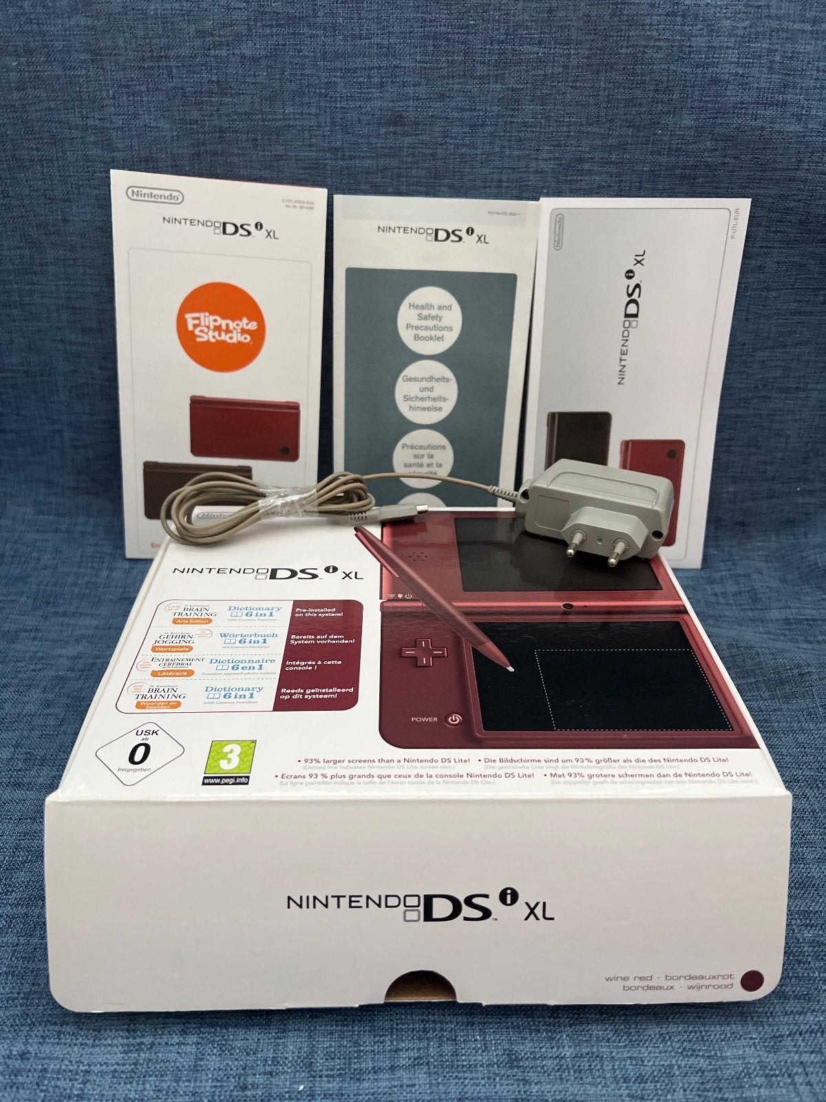 Nintendo DSi XL , OVP, Ladekabel,  2x Spiele, ohne Stift, Bordeauxrot